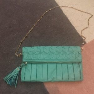 Mint clutch/crossbody bag with tassel